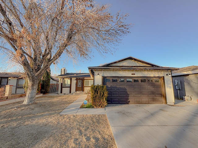 ranch-style house featuring a garage