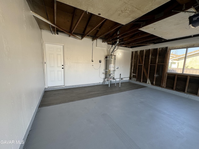 25561 Alicante Dr, Santa Clarita, CA 91355 - garage featuring strapped water heater and a garage door opener
