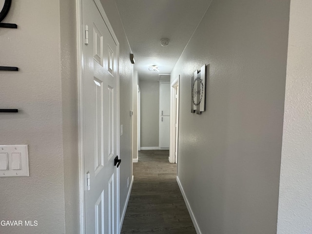 25561 Alicante Dr, Santa Clarita, CA 91355 - hallway with dark wood-style flooring and baseboards