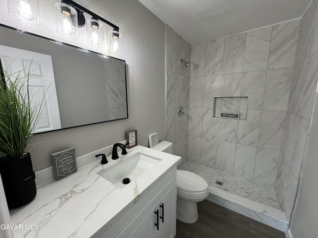 25561 Alicante Dr, Santa Clarita, CA 91355 - full bath featuring vanity, a tile shower, and wood finished floors
