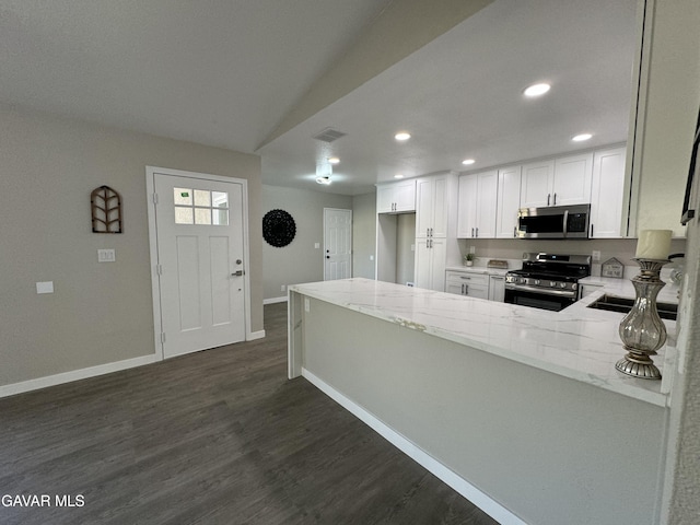 25561 Alicante Dr, Santa Clarita, CA 91355 - kitchen featuring stainless steel appliances, light stone countertops, dark wood finished floors, white cabinets, and recessed lighting