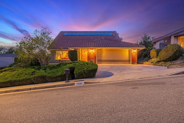 28367 Mount Stephen Ave, Santa Clarita, CA 91387 - view of front of house with a tiled roof, a garage, and driveway