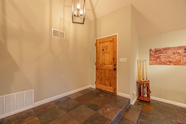 28367 Mount Stephen Ave, Santa Clarita, CA 91387 - foyer entrance featuring stone tile floors, baseboards, and lofted ceiling