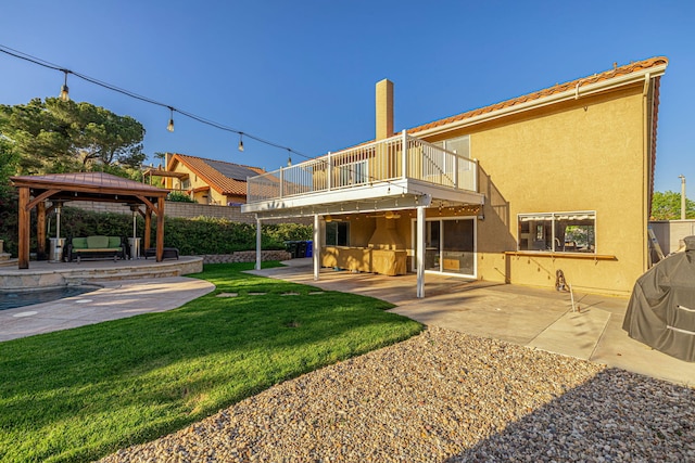 28367 Mount Stephen Ave, Santa Clarita, CA 91387 - back of house with a balcony, an outdoor hangout area, a patio, a gazebo, and stucco siding