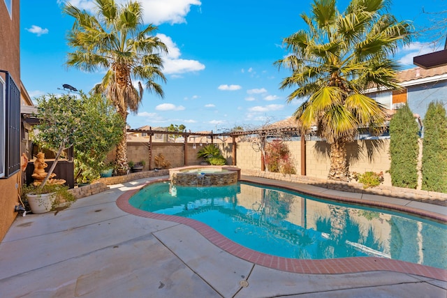 view of swimming pool with a patio area and an in ground hot tub