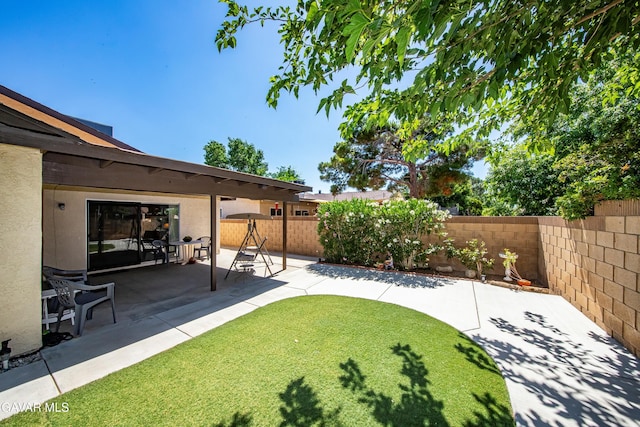 1037 Herzel Ave, Lancaster, CA 93535 - fenced backyard with a patio