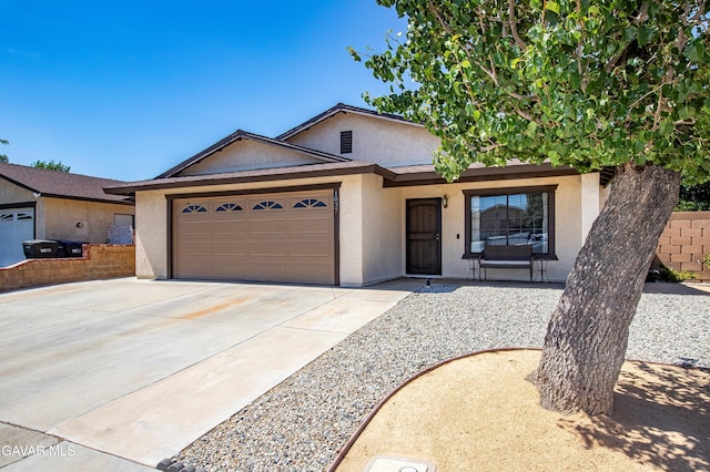 1037 Herzel Ave, Lancaster, CA 93535 - single story home with stucco siding, an attached garage, driveway, and a porch