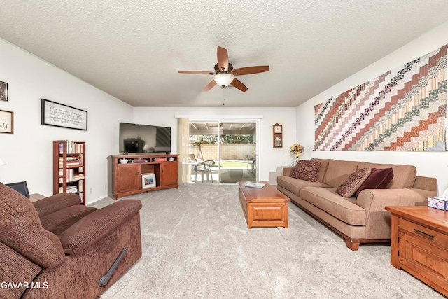 1037 Herzel Ave, Lancaster, CA 93535 - living room with light carpet, a ceiling fan, and a textured ceiling