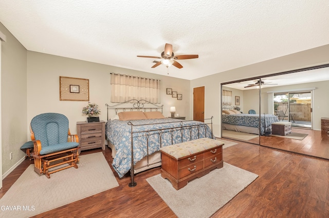 1037 Herzel Ave, Lancaster, CA 93535 - bedroom featuring dark wood-style flooring, a ceiling fan, a textured ceiling, and access to outside