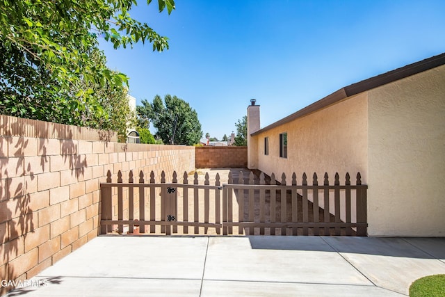 1037 Herzel Ave, Lancaster, CA 93535 - gate featuring a patio area