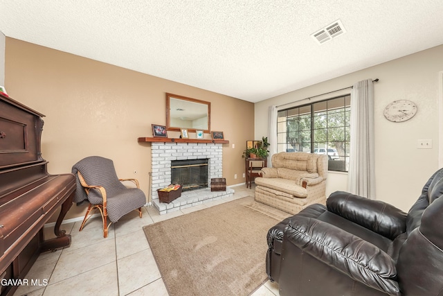 1037 Herzel Ave, Lancaster, CA 93535 - living area with light tile patterned floors, a textured ceiling, and a fireplace