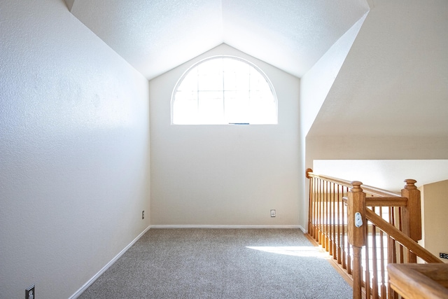 42443 Surrey Ct, Quartz Hill, CA 93536 - carpeted empty room with lofted ceiling and baseboards