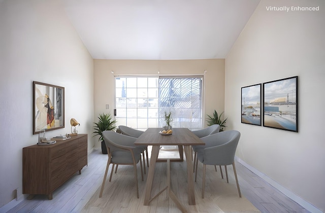 42443 Surrey Ct, Quartz Hill, CA 93536 - dining area featuring light wood-type flooring, baseboards, and vaulted ceiling