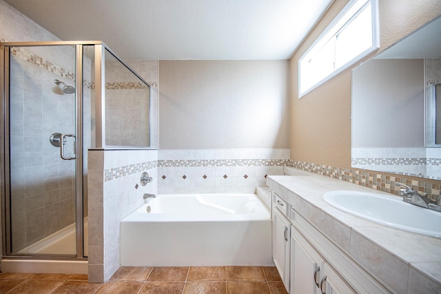 42443 Surrey Ct, Quartz Hill, CA 93536 - full bathroom featuring a bath, vanity, a shower stall, and tile patterned flooring