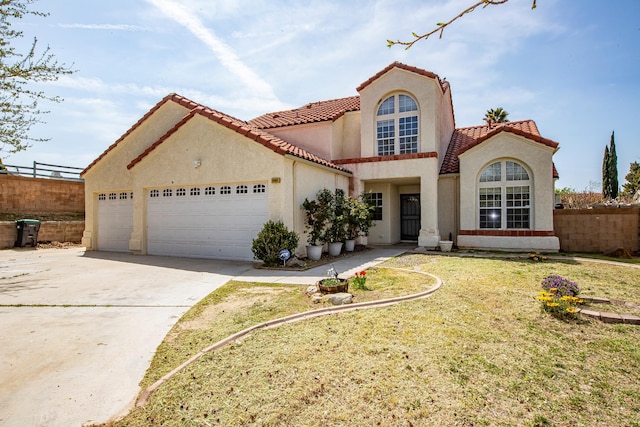 42443 Surrey Ct, Quartz Hill, CA 93536 - mediterranean / spanish-style house with an attached garage, stucco siding, a tile roof, and driveway
