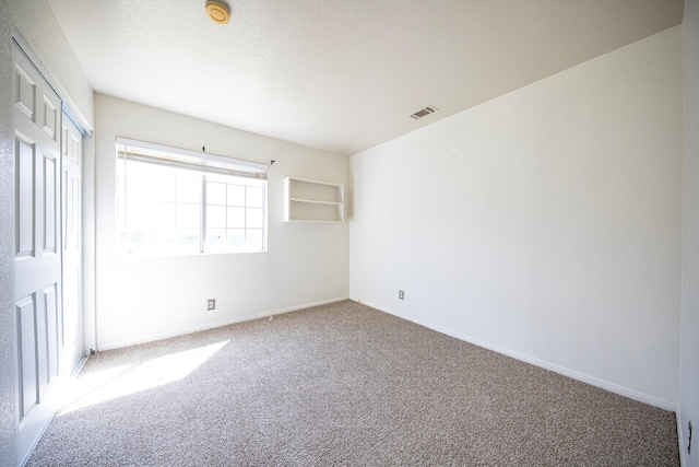 42443 Surrey Ct, Quartz Hill, CA 93536 - unfurnished bedroom featuring carpet, a closet, and baseboards