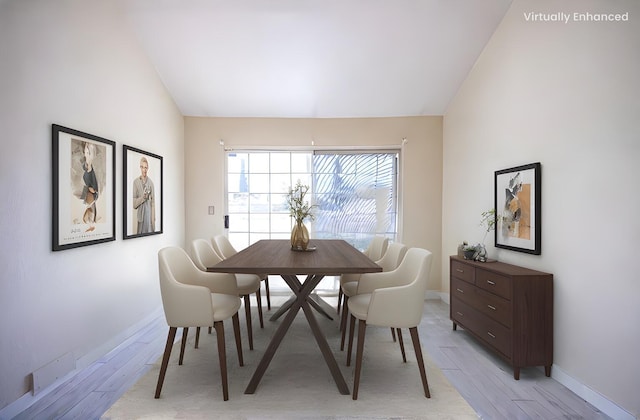 42443 Surrey Ct, Quartz Hill, CA 93536 - dining space featuring light wood finished floors, baseboards, and vaulted ceiling
