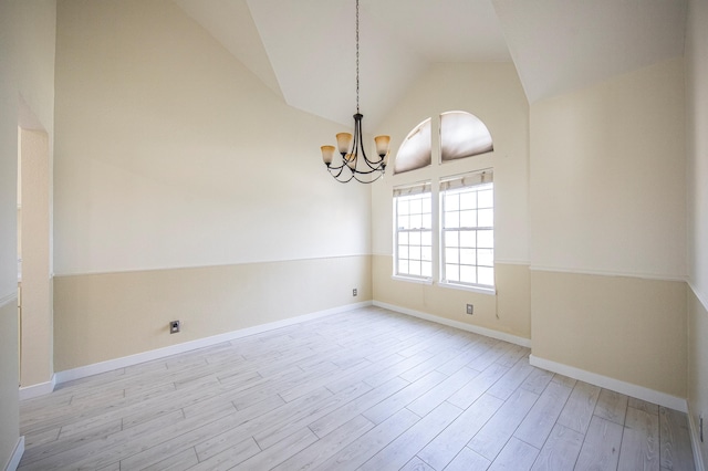 42443 Surrey Ct, Quartz Hill, CA 93536 - spare room with a chandelier, wood finished floors, baseboards, and high vaulted ceiling