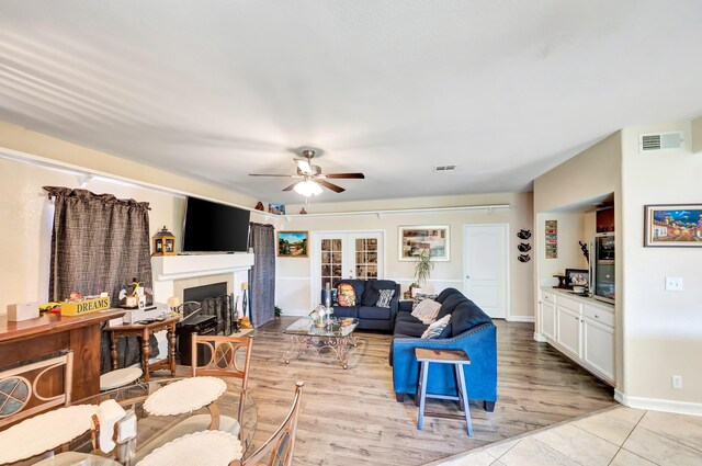 39884 Golfers Dr, Palmdale, CA 93551 - living area with ceiling fan, a fireplace with flush hearth, baseboards, and light wood finished floors