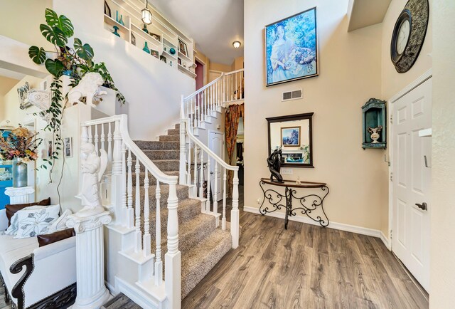 39884 Golfers Dr, Palmdale, CA 93551 - foyer entrance featuring wood finished floors, stairway, and baseboards