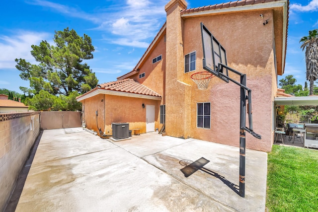 39884 Golfers Dr, Palmdale, CA 93551 - back of property featuring cooling unit, a tile roof, stucco siding, and a patio area