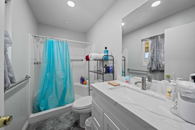 bathroom featuring vanity, a shower with curtain, and toilet