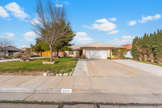 single story home featuring a front yard, stucco siding, concrete driveway, a garage, and a tile roof