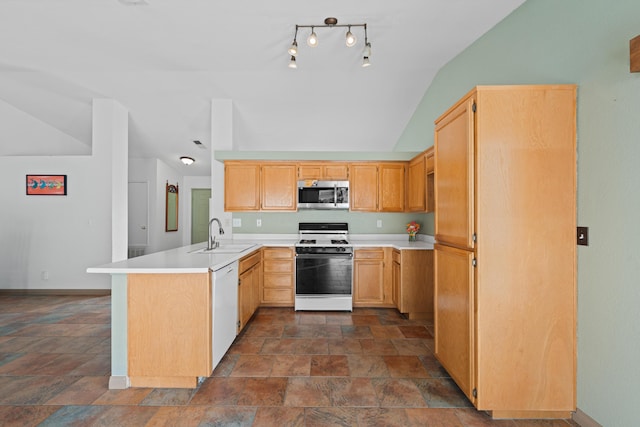 kitchen with a sink, white appliances, a peninsula, light countertops, and vaulted ceiling