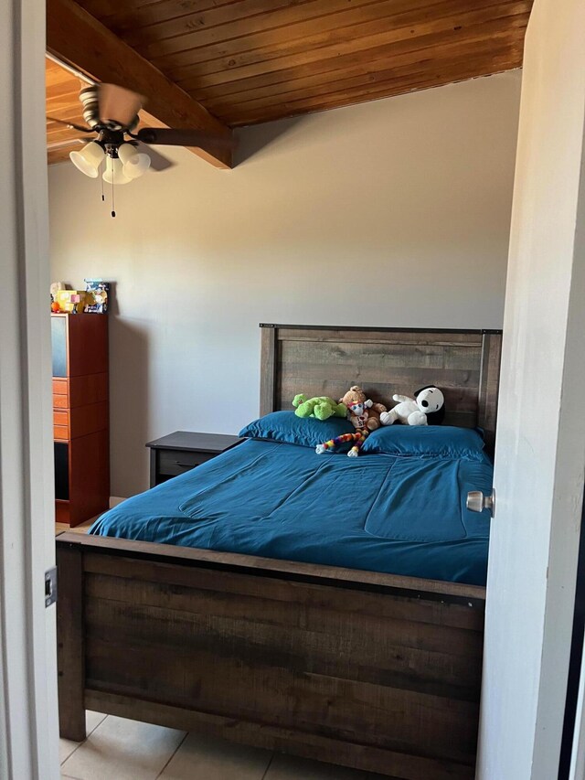 3354 Arthur Ave, Mojave, CA 93501 - bedroom with wood ceiling with exposed beams and light tile patterned flooring