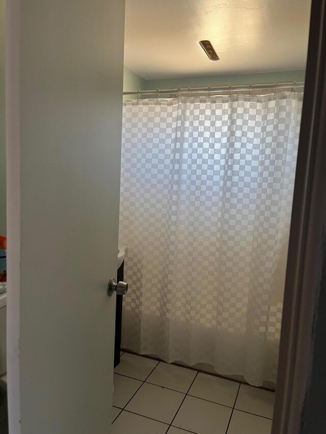3354 Arthur Ave, Mojave, CA 93501 - bathroom featuring tile patterned flooring and a shower