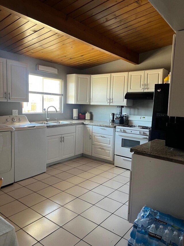 3354 Arthur Ave, Mojave, CA 93501 - kitchen with separate washer and dryer, gas range gas stove, a sink, under cabinet range hood, and light tile patterned floors