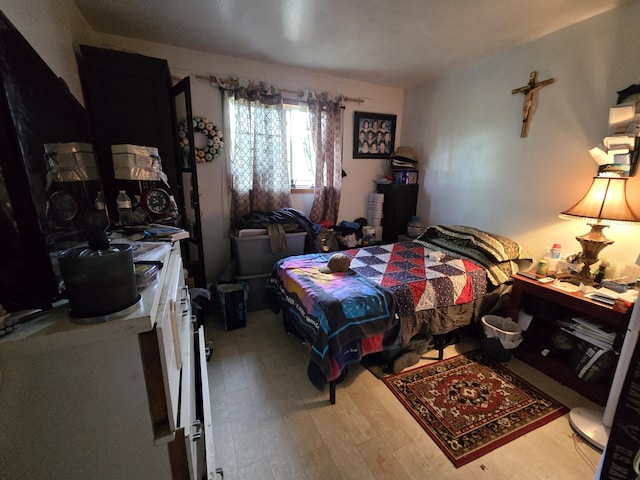 bedroom featuring wood finished floors