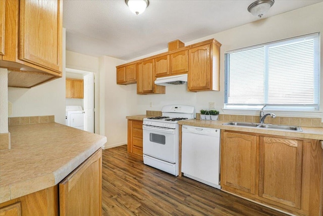 kitchen with white appliances, sink, and dark wood-type flooring