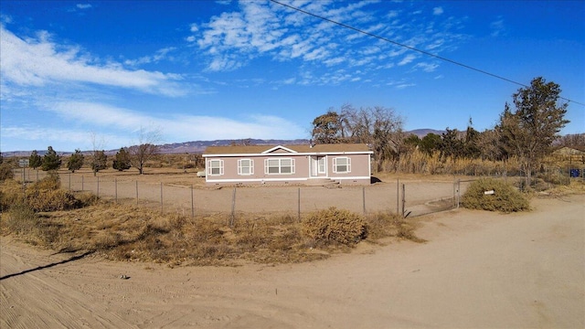 view of home's exterior with a mountain view and a rural view