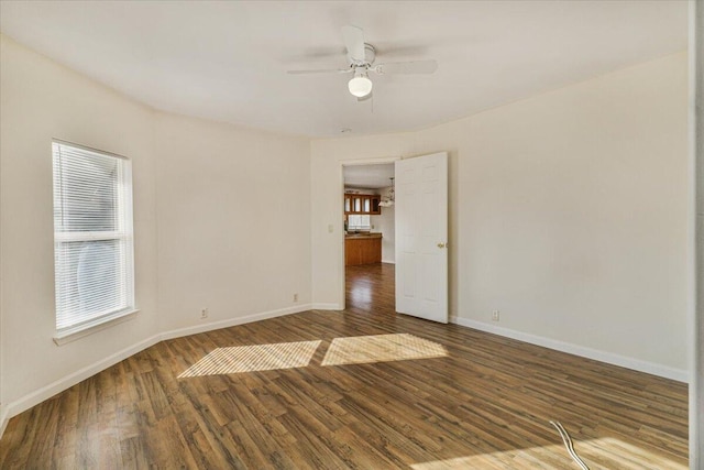 spare room featuring hardwood / wood-style flooring and ceiling fan