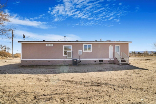 rear view of property featuring central air condition unit