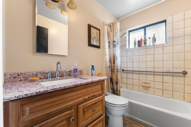 full bathroom with vanity, toilet, and shower / tub combo with curtain