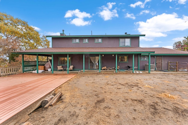 rear view of house with central AC unit