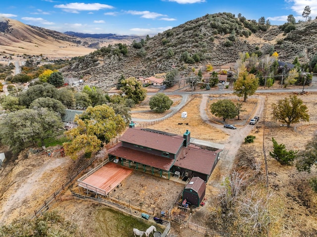 birds eye view of property featuring a mountain view