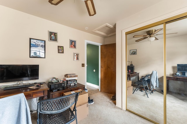 carpeted office with ceiling fan