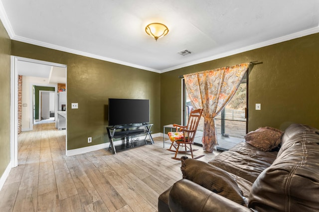 living room featuring light wood-type flooring and crown molding