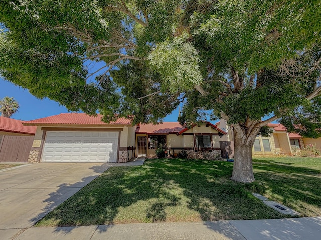 ranch-style home featuring a front yard and a garage