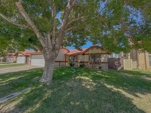 view of front of home with a garage and a front yard