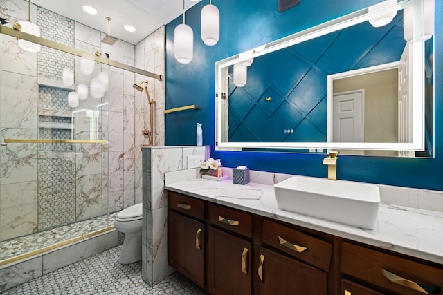 bathroom featuring toilet, vanity, recessed lighting, and a shower stall