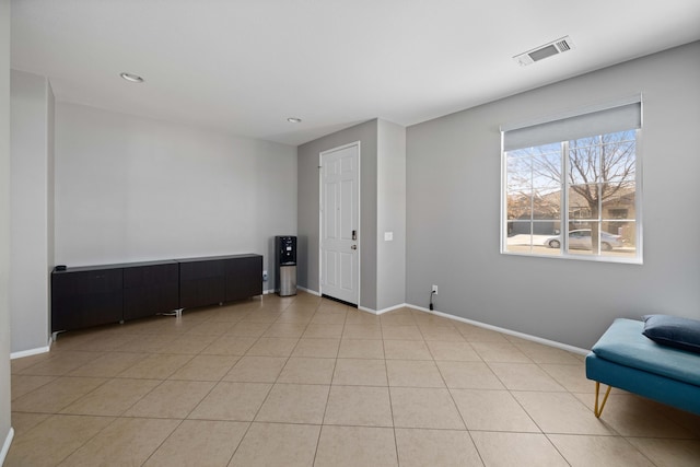 living area featuring baseboards, visible vents, recessed lighting, and light tile patterned floors