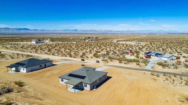 aerial view with view of desert, a rural view, and a mountain view