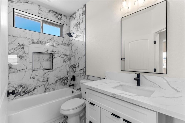 bathroom featuring toilet, marble finish floor, shower / tub combination, and vanity
