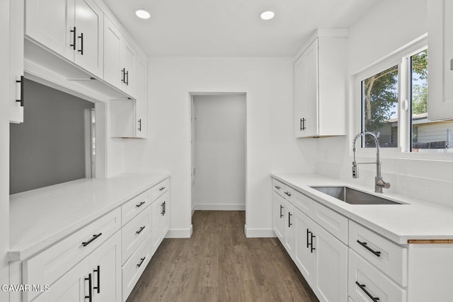 35114 E 82nd St Unit E, Littlerock, CA 93543 - kitchen featuring dark wood finished floors, recessed lighting, white cabinetry, and light stone counters