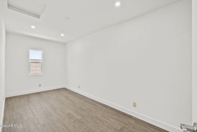 35114 E 82nd St Unit E, Littlerock, CA 93543 - spare room with attic access, wood finished floors, and recessed lighting