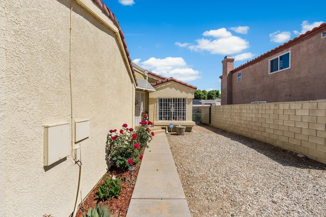 2321 Mulberry Ave, Lancaster, CA 93535 - view of home's exterior featuring stucco siding and fence